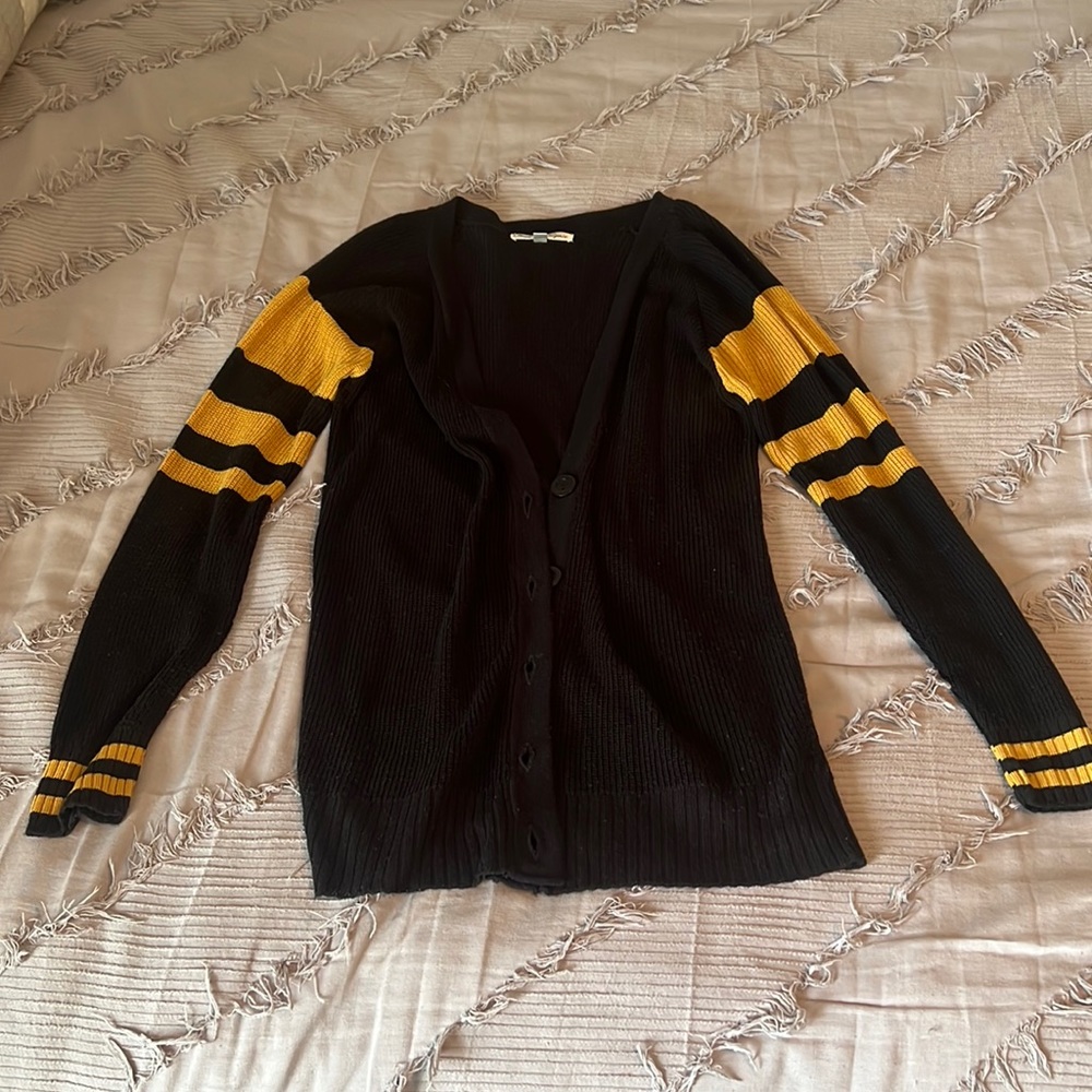 Black and yellow, button up sweater/cardigan.